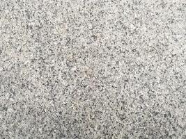 white-painted concrete floor with a crumpled effect, adding texture to your project. photo