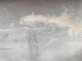 Concrete backdrop with a scratched and messy effect. photo