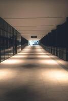 Front view of office corridor with warm lighting photo