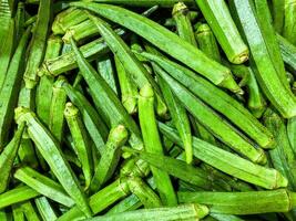 Close up of green okra texture background. Organic vegetable photo