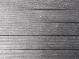 Abstract design with a mix of light and dark wooden planks forming a unique pattern. photo