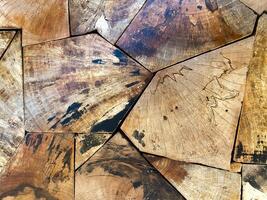 Empty wooden table top, providing a blank canvas for showcasing products or other elements. photo