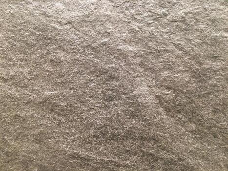 Closeup of a rough and grunge surface with an abstract paint pattern on concrete. photo