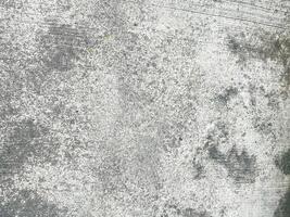 Retro design featuring a scratched and messy concrete surface. photo