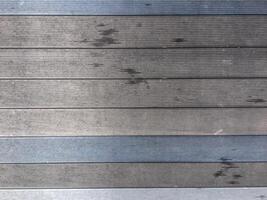 Abstract design with a mix of light and dark wooden planks forming a unique pattern. photo
