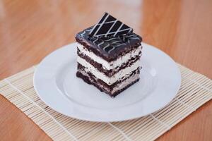 Delicious chocolate cake on a white plate photo