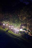 Night scene of a bridge over a river with a lighted lanterns photo