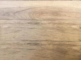 Empty wooden table top, providing a blank canvas for showcasing products or other elements. photo