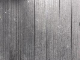 Abstract design with a mix of light and dark wooden planks forming a unique pattern. photo