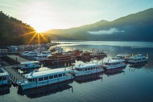 sunrise at sun moon lake in nantou, taiwan photo