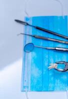 Tools for Every Task. A pair of scissors, a pair of pliers, and a pair of surgical photo