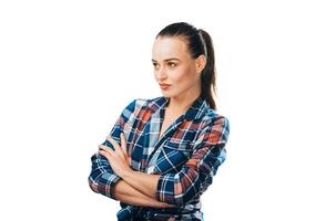 A Confident Woman Standing with Crossed Arms. A woman standing with her arms crossed photo