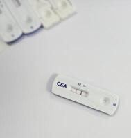 Rapid test cassette for CEA or carcinoembryonic antigen test showing positive result, tumor marker for Colon cancer. Colorectal cancer. photo