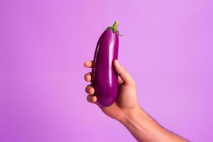 AI generated A woman's hand holds an eggplant isolated on a pink background. AI Generative photo