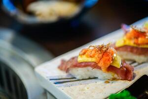 Sushi Wagyu Cheese on white plate, Premium Japanese meat concept. photo