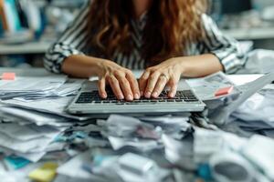 AI generated Hands of a person desperately trying to work on a keyboard buried under a mountain of unorganized paperwork, symbolizing extreme work overload. photo