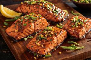 AI generated A wooden cutting board with four salmon fillets topped with green onions and a glaze. photo