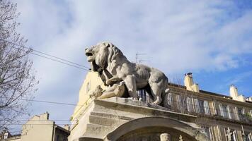 Stone lion sculpture, oldest street in the capital of Spain, the city of Madrid. Stock. Lion statue in the middle of a European city video