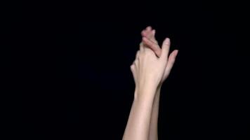 Hands applauding isolated on a black background. Clapping hands over a black background video