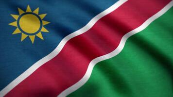 vlag van Namibië met kleding stof textuur, naadloos lus. Namibië vlag golvend in de wind. achtergrond met ruw textiel textuur. animatie lus video