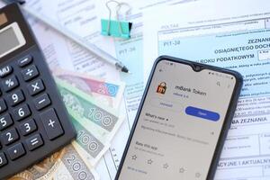 TERNOPIL, UKRAINE - AUGUST 3, 2023 mBank application on screen on modern smartphone. Official app of famous polish bank photo