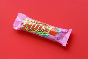 KYIV, UKRAINE - MAY 4, 2022 Nuts original chocolate bar manufactured by Nestle company photo