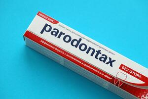 KYIV, UKRAINE - MAY 4, 2022 Package of Parodontax toothpaste on bright background photo