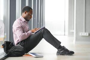 Portrait of african boy at college campus photo