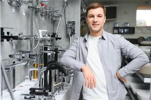 man chooses a bathroom faucet in a construction supermarket, plumbing repairs in the house photo