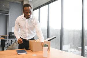 Portrait of african american employee being fired. photo