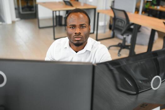 Stock Market Day Trader Working on Computer with Multi-Monitor Workstation with Real-Time Investmentment Charts photo