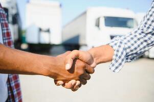 Logistics and Transportation Truck and Cargo ship with Business Collaboration, Businessman shake hands, logistic import export and transport industry background photo