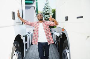 Truck Driver man African American muscular smiling, in long-time business transportation and delivery photo