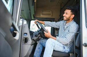 Young Indian truck driver. Concept of road freight transportation. photo