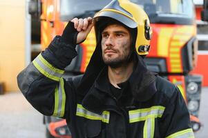 tired firefighter after work in a fire department photo