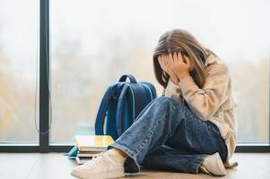 A Unhappy depress Pre teen girl at school photo