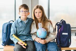 Portrait of two schoolchildren a boy and a girl photo