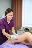 Master of depilation preparation for procedure of hair removal photo