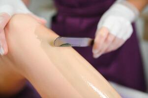 wax hair removal, shugaring. concept of smooth skin without hair photo