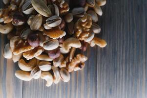 mix nuts on a wooden table photo