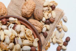 Mixed nuts on a plate. White background photo