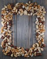 mix nuts on a wooden table photo