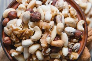 mix nuts on a wooden table photo