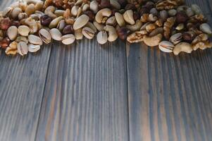 mix nuts on a wooden table photo