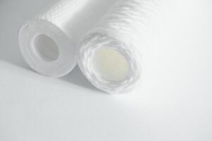 filter cartridges for water on a white background. Installation of reverse osmosis water purification system. photo