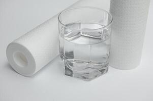 filter cartridges for water on a white background. Installation of reverse osmosis water purification system. photo