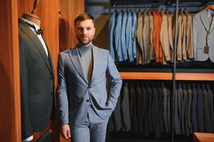 Perfect to the last detail. Modern businessman. Fashion shot of a handsome young man in elegant classic suit photo