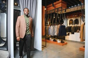 African businessman in elegant classic suit in a premium men's clothing store photo