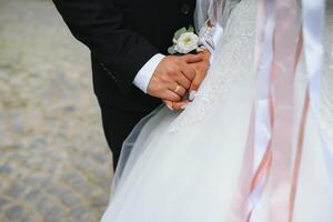 Hands of the bride and groom close-up. photo