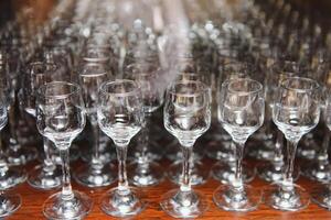 Set of empty glasses on table indoors. photo